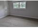 Bedroom with plush carpet, a window, and light neutral walls at 4719 National Dr., Myrtle Beach, SC 29579