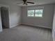 Cozy bedroom with neutral carpet, walls, ceiling fan and great natural light at 4719 National Dr., Myrtle Beach, SC 29579