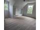 Sunlit bedroom with cozy carpet, a built in, and two windows for beautiful outdoor views at 4719 National Dr., Myrtle Beach, SC 29579