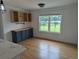 Bright dining area features shiplap walls, a large window, hardwood flooring and storage with butcher block top at 4719 National Dr., Myrtle Beach, SC 29579