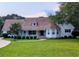 Charming single-story home featuring a well-manicured lawn, complemented by mature trees and meticulous landscaping at 4719 National Dr., Myrtle Beach, SC 29579