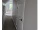 Hallway leading into bedroom with built in shelves and good natural light at 4719 National Dr., Myrtle Beach, SC 29579