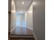 Hallway with wood flooring and neutral colored walls, leading to other rooms in the home at 4719 National Dr., Myrtle Beach, SC 29579