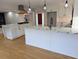 View of bright kitchen with marble countertops, stainless appliances, and large center island with bar stool seating at 4719 National Dr., Myrtle Beach, SC 29579