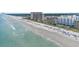 Beautiful aerial view of the coastline with sandy beach and beachfront condos at 4719 S Ocean Blvd. # 108, North Myrtle Beach, SC 29582