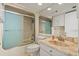 Bathroom featuring shower with sliding glass door, single sink with granite top, and large mirror at 4719 S Ocean Blvd. # 108, North Myrtle Beach, SC 29582