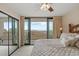 Inviting bedroom featuring balcony access and stunning ocean views for a relaxing retreat at 4719 S Ocean Blvd. # 108, North Myrtle Beach, SC 29582