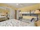 Comfortable bedroom with bunk beds, ceiling fan, and views into attached sleeping space at 4719 S Ocean Blvd. # 108, North Myrtle Beach, SC 29582