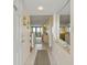 View of a condo's entryway leading to the living area and ocean views beyond at 4719 S Ocean Blvd. # 108, North Myrtle Beach, SC 29582