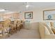 Open floor plan with bar seating into the kitchen, which has wood cabinets and appliances at 4719 S Ocean Blvd. # 108, North Myrtle Beach, SC 29582
