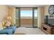 Bright living room with large sliding doors to the balcony and elegant furnishings at 4719 S Ocean Blvd. # 108, North Myrtle Beach, SC 29582