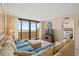 Relaxing living room with comfortable seating and an ocean view through sliding glass doors at 4719 S Ocean Blvd. # 108, North Myrtle Beach, SC 29582