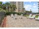 Outdoor lounge area featuring seating, grills, and well-maintained landscaping at 4719 S Ocean Blvd. # 108, North Myrtle Beach, SC 29582