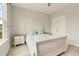 Cozy bedroom featuring wood floors, neutral paint, a large window, and a bed at 5087 Sundrop Ln., Little River, SC 29566