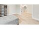 Bonus room with hardwood floors and view of the kitchen in the distance at 5087 Sundrop Ln., Little River, SC 29566