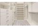 Spacious walk-in closet with custom shelving and drawers for optimal organization at 5087 Sundrop Ln., Little River, SC 29566