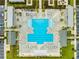 A bird's eye view of a lavish community pool surrounded by tanning decks, cabanas, and meticulously maintained grounds at 5087 Sundrop Ln., Little River, SC 29566