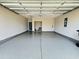 Clean and spacious garage with epoxy flooring and ample room for storage at 5087 Sundrop Ln., Little River, SC 29566