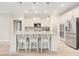 Beautiful kitchen showcasing white cabinets, stainless steel appliances, and a large island with barstool seating at 5087 Sundrop Ln., Little River, SC 29566