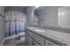 Bright bathroom with modern cabinets, countertop, sink, toilet and a large mirror at 520 Oak Pond Ct., Conway, SC 29526