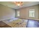 Large bedroom features wood floors, ceiling fan, and bright windows with outdoor views at 520 Oak Pond Ct., Conway, SC 29526