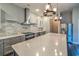 Spacious kitchen features stainless steel appliances, a large island, and modern lighting fixtures at 520 Oak Pond Ct., Conway, SC 29526