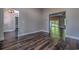 Open living space boasts dark hardwood floors, neutral walls, and views into other rooms at 520 Oak Pond Ct., Conway, SC 29526