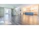 Open-concept living area with dark wood floors, a staircase, and a view into the kitchen at 520 Oak Pond Ct., Conway, SC 29526