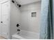 Bathroom featuring a shower over tub with tiled surround and niche at 5515 N Ocean Blvd. N # 206, Myrtle Beach, SC 29577
