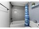 Modern bathroom featuring a tiled shower/tub combination and neutral wall paint at 5515 N Ocean Blvd. N # 206, Myrtle Beach, SC 29577