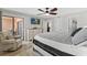 Inviting bedroom featuring balcony access, TV, and ensuite bathroom at 5515 N Ocean Blvd. N # 206, Myrtle Beach, SC 29577