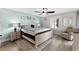 Comfortable bedroom featuring wood floors and ample natural light at 5515 N Ocean Blvd. N # 206, Myrtle Beach, SC 29577
