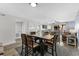 Dining area featuring a large table with seating for six, alongside a kitchen at 5515 N Ocean Blvd. N # 206, Myrtle Beach, SC 29577