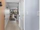 Light and airy entryway with tile floors, leading to living space with beachy decor at 5515 N Ocean Blvd. N # 206, Myrtle Beach, SC 29577