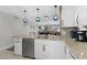 Open concept kitchen with granite counters, stainless appliances, and pendant lighting at 5515 N Ocean Blvd. N # 206, Myrtle Beach, SC 29577