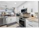 Renovated kitchen with granite countertops, stainless steel appliances, and modern finishes at 5515 N Ocean Blvd. N # 206, Myrtle Beach, SC 29577