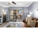 Cozy living room with balcony access offering outdoor views at 5515 N Ocean Blvd. N # 206, Myrtle Beach, SC 29577