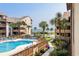 Community pool offers great views of the ocean surrounded by palm trees and walkways at 5515 N Ocean Blvd. N # 206, Myrtle Beach, SC 29577