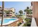 Scenic view of a pool area with palm trees and condominium buildings in the background at 5515 N Ocean Blvd. N # 206, Myrtle Beach, SC 29577