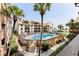 Resort pool surrounded by lush landscaping and palm trees, with lounge chairs and ocean views at 5515 N Ocean Blvd. N # 206, Myrtle Beach, SC 29577