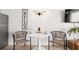 Bright dining area featuring a round table, modern chairs, and a 'RELAX' wall decor for a comfortable atmosphere at 5523 N Ocean Blvd. # 2006, Myrtle Beach, SC 29577
