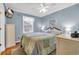 This charming bedroom features a cozy bed, ceiling fan, and a mounted TV for relaxing evenings at 6001 - Q21 South Kings Hwy., Myrtle Beach, SC 29575