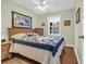 Inviting bedroom featuring hardwood floors, a window, and a ceiling fan for added comfort at 6001 - Q21 South Kings Hwy., Myrtle Beach, SC 29575