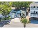 Charming blue house with a welcoming front porch, palm tree and private parking at 6001 - Q21 South Kings Hwy., Myrtle Beach, SC 29575