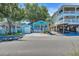 Charming beach cottage with blue siding and inviting front porch at 6001 - Q21 South Kings Hwy., Myrtle Beach, SC 29575
