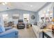 Bright and airy living room with vaulted ceilings, a comfortable sofa, and a dining area at 6001 - Q21 South Kings Hwy., Myrtle Beach, SC 29575