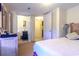 Bedroom showing doors to a bathroom and closet, a comfortable bed and soft lighting for a serene retreat at 609 3Rd Ave. N, Myrtle Beach, SC 29577