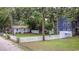 Charming home with a white picket fence and well-maintained lawn, surrounded by trees at 609 3Rd Ave. N, Myrtle Beach, SC 29577