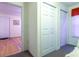 Hallway and door with access to another room, with light-toned walls and wood floors at 609 3Rd Ave. N, Myrtle Beach, SC 29577