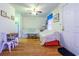 Bright living room with hardwood floors and ceiling fan, furniture covered in white sheets at 609 3Rd Ave. N, Myrtle Beach, SC 29577